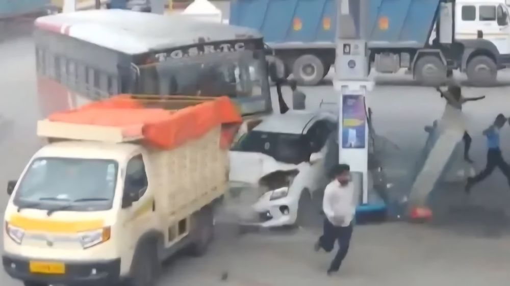 A TSRTC bus crashes into a petrol station while trying to avoid an auto-rickshaw.
